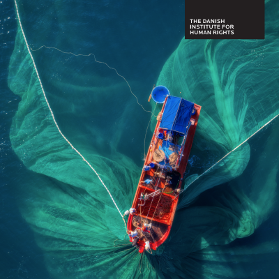 Image showing an orange fishing vessel on blue-green water, from above, with a wide net cast out into the water