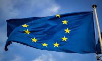 European Union flag with blue sky as background