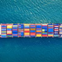 Picture showing a container ship at sea seen from above